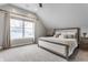 Cozy bedroom with vaulted ceilings, neutral tones, carpeted floor, and abundant natural light at 1041 S State Ave, Indianapolis, IN 46203