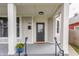 Inviting front porch with modern railing, decorative planters, and a stylish front door at 1041 S State Ave, Indianapolis, IN 46203
