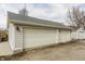 A detached two-car garage with painted siding and updated gray shingled roof at 1041 S State Ave, Indianapolis, IN 46203