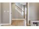 Open hallway with hardwood floors and a view of the staircase at 1041 S State Ave, Indianapolis, IN 46203