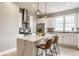 Bright kitchen with white cabinetry, stainless steel appliances, and quartz countertops at 1041 S State Ave, Indianapolis, IN 46203