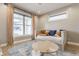 Cozy living room featuring a daybed, stylish rug, and plenty of natural light at 1041 S State Ave, Indianapolis, IN 46203