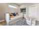 Cozy living room featuring a daybed, stylish rug, and built-in shelving at 1041 S State Ave, Indianapolis, IN 46203