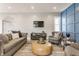 Comfortable living room features stylish furniture, hardwood floors, and blue accent wall at 1041 S State Ave, Indianapolis, IN 46203