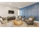 Comfortable living room with modern decor, accent wall, and ample seating at 1041 S State Ave, Indianapolis, IN 46203