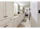 Bathroom with double sink vanity, granite countertops, custom cabinets, and tile flooring at 113 Edgewater Dr, Noblesville, IN 46062