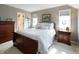 Inviting bedroom with natural light, soft carpet, and wood dresser at 113 Edgewater Dr, Noblesville, IN 46062