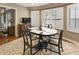 Charming dining area with water views, a round table, and a neutral rug at 113 Edgewater Dr, Noblesville, IN 46062