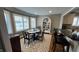 Inviting dining area featuring a lake view, and a stylish rug and built-in shelving at 113 Edgewater Dr, Noblesville, IN 46062