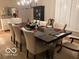 Dining room showcasing a dining table set for eight, an elegant chandelier and plentiful light at 113 Edgewater Dr, Noblesville, IN 46062