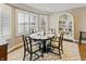 Bright dining room with water views, a round table, and a decorative white bookshelf at 113 Edgewater Dr, Noblesville, IN 46062