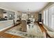 Comfortable dining room with a wooden table, chandelier, hardwood floors, and natural light at 113 Edgewater Dr, Noblesville, IN 46062