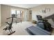 Home gym features exercise equipment, neutral carpet, and natural light at 113 Edgewater Dr, Noblesville, IN 46062