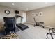 Home gym features exercise equipment, neutral carpet, and natural light at 113 Edgewater Dr, Noblesville, IN 46062