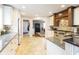 Kitchen with stainless appliances, tile flooring, and an opening to the dining room at 113 Edgewater Dr, Noblesville, IN 46062
