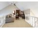 Comfortable living room featuring neutral tones, a ceiling fan, and a cozy seating area at 113 Edgewater Dr, Noblesville, IN 46062