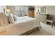 A bright main bedroom offers a calming retreat with ample space and neutral color palette at 113 Edgewater Dr, Noblesville, IN 46062