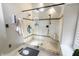 A glass shower enclosure features tiled walls, dual shower heads, and a built-in corner seat at 113 Edgewater Dr, Noblesville, IN 46062