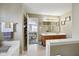 Bathroom showcasing a double sink, bathtub, and doorway view into a bedroom at 11624 Eldridge Dr, Indianapolis, IN 46235