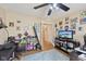 Bedroom featuring a ceiling fan, plenty of natural light, and wall decor at 11624 Eldridge Dr, Indianapolis, IN 46235