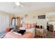 Inviting bedroom featuring a ceiling fan, a double closet and salmon color bedding at 11624 Eldridge Dr, Indianapolis, IN 46235