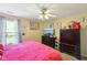 Bedroom featuring a fan, natural light and a dark dresser at 11624 Eldridge Dr, Indianapolis, IN 46235