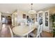 Spacious dining area featuring chandelier and cabinet with decor at 11624 Eldridge Dr, Indianapolis, IN 46235