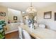 Bright dining room featuring a chandelier and a view of the staircase at 11624 Eldridge Dr, Indianapolis, IN 46235
