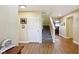Inviting foyer with hardwood floors, staircase and neutral wall colors at 11624 Eldridge Dr, Indianapolis, IN 46235