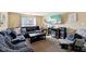 Comfortable living room featuring neutral colored walls, plush sectional sofa, and wall decor at 11624 Eldridge Dr, Indianapolis, IN 46235