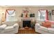 Bright living room featuring a fireplace with white mantle and comfortable seating at 11624 Eldridge Dr, Indianapolis, IN 46235
