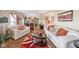 Spacious living room with hardwood floors, white sofas and bright, colorful decor at 11624 Eldridge Dr, Indianapolis, IN 46235