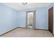 Bright bedroom featuring neutral carpet, a window for natural light and a ceiling light fixture at 12 Danridge Dr, Danville, IN 46122