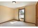 Inviting bedroom features neutral carpet, a window overlooking outdoors, and a classic ceiling light at 12 Danridge Dr, Danville, IN 46122