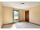 Cozy bedroom with neutral-toned walls, carpet, a window, and a classic ceiling light at 12 Danridge Dr, Danville, IN 46122