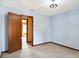 Light-filled bedroom with neutral carpet, access to another room and a modern ceiling light at 12 Danridge Dr, Danville, IN 46122