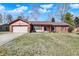 Charming single-story home with a brick facade, attached garage, and well-maintained lawn at 12 Danridge Dr, Danville, IN 46122