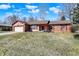 Charming single-story brick home with an attached garage, and mature landscaping at 12 Danridge Dr, Danville, IN 46122