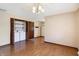 Hardwood flooring with the laundry area, closet space and doorway view at 12 Danridge Dr, Danville, IN 46122
