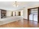 Living room with hardwood flooring, fireplace and utility closet at 12 Danridge Dr, Danville, IN 46122