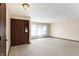 Spacious living room featuring neutral carpet, bright windows, and a welcoming atmosphere at 12 Danridge Dr, Danville, IN 46122
