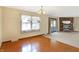Living room with hardwood flooring, fireplace and large window at 12 Danridge Dr, Danville, IN 46122