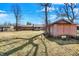 Backyard view with an outbuilding, trees and space for gardening at 12 Danridge Dr, Danville, IN 46122