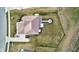 Aerial view showcasing a large backyard with a fire pit area and manicured landscaping and mulch beds at 12073 Springtide Ln, Fishers, IN 46037