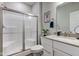 Bathroom showcasing a glass enclosed shower, white vanity, and modern fixtures at 12073 Springtide Ln, Fishers, IN 46037