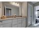 Bathroom featuring double sink vanity with white cabinets and gray countertop at 12073 Springtide Ln, Fishers, IN 46037