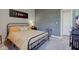 Comfortable bedroom with plush carpet, moon phase art, and neutral color palette at 12073 Springtide Ln, Fishers, IN 46037