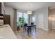 Bright dining area featuring natural light, modern décor, and seamless flow to the kitchen at 12073 Springtide Ln, Fishers, IN 46037