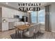 Charming dining area with stylish table and chairs near a modern kitchen at 12073 Springtide Ln, Fishers, IN 46037