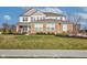 Charming two-story home with a well-maintained lawn and landscaping at 12073 Springtide Ln, Fishers, IN 46037